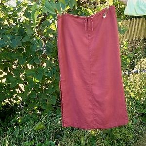 Long red linen drawstring skirt. Side slits.